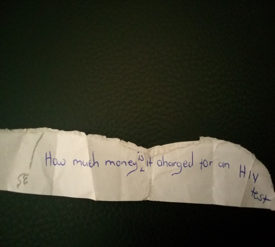 Handwritten student question: How much money is charged for an HIV test?
